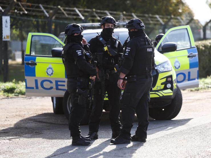 Armed police officers outside the RAF Fairford base.