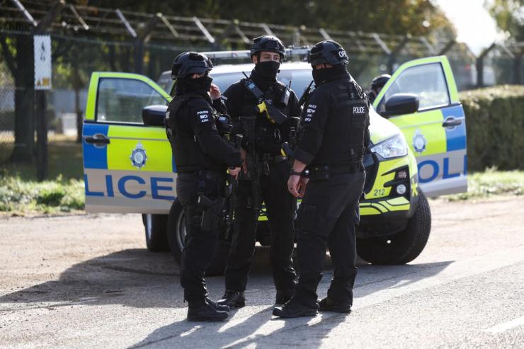 Armed police officers outside the RAF Fairford base.