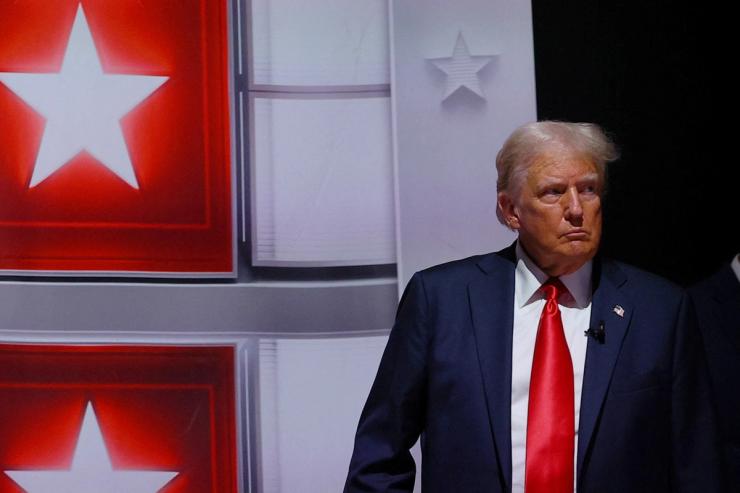 Republican presidential candidate former U.S. President Donald Trump walks back to his podium after a commercial break during a debate with Democrat presidential candidate U.S. President Joe Biden, in Atlanta, Georgia, U.S., June 27, 2024. REUTERS/Brian Snyder