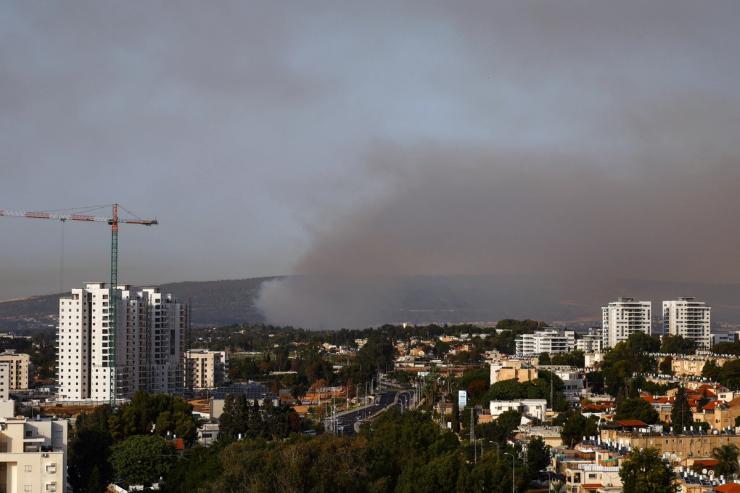 Smoke rises above Israel’s border with Lebanon, as seen from Nahariya in northern Israel, October 22, 2023. REUTERS/Lisi Niesner
