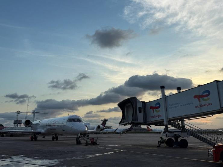 A commercial plane is parked at the airport in Lagos.