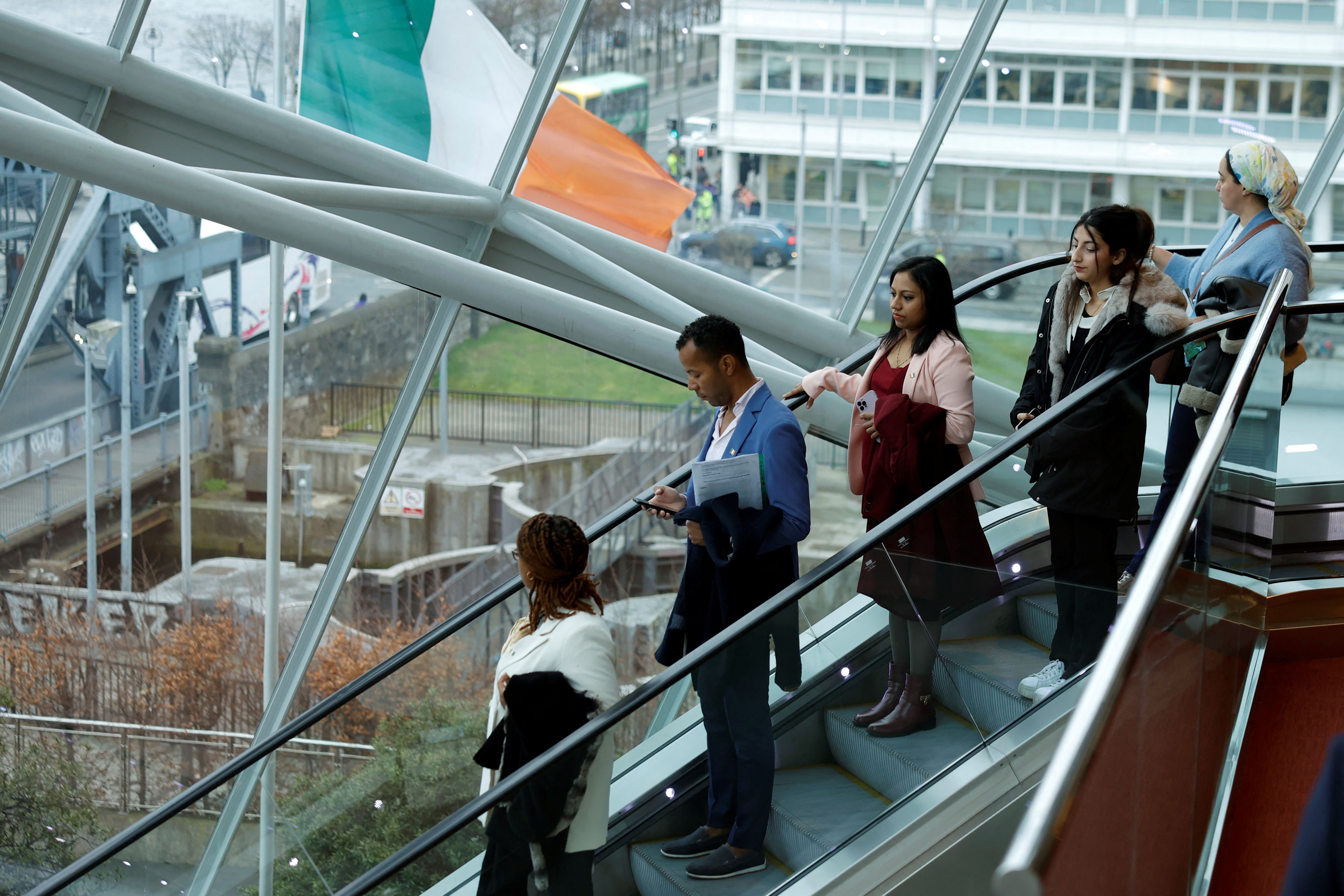 People depart a ceremony conferring around 5000 people with Irish citizenship in Dublin, Ireland