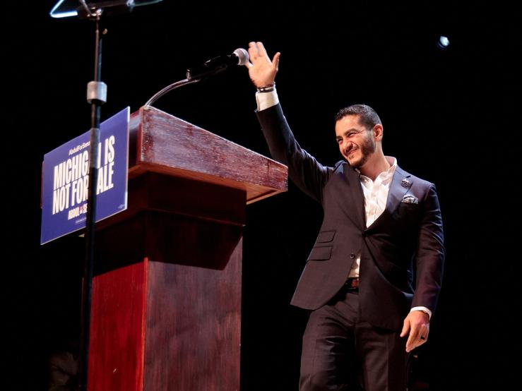 U.S. Senate Democratic candidate Abdul El-Sayed waves on stage, with vote counting continuing for Michigan’s Democratic U.S. Senate primary, during an election night rally in Detroit, Michigan.