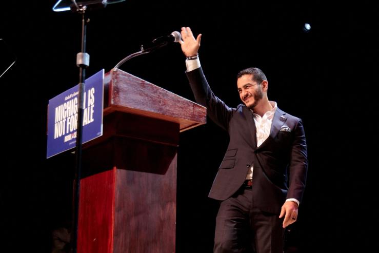 U.S. Senate Democratic candidate Abdul El-Sayed waves on stage, with vote counting continuing for Michigan’s Democratic U.S. Senate primary, during an election night rally in Detroit, Michigan.