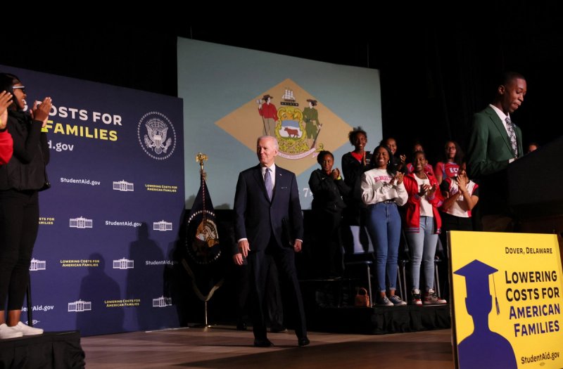 U.S. President Joe Biden reacts to the crowd as he is introduced before delivering remarks about student debt relief at Delaware State University.