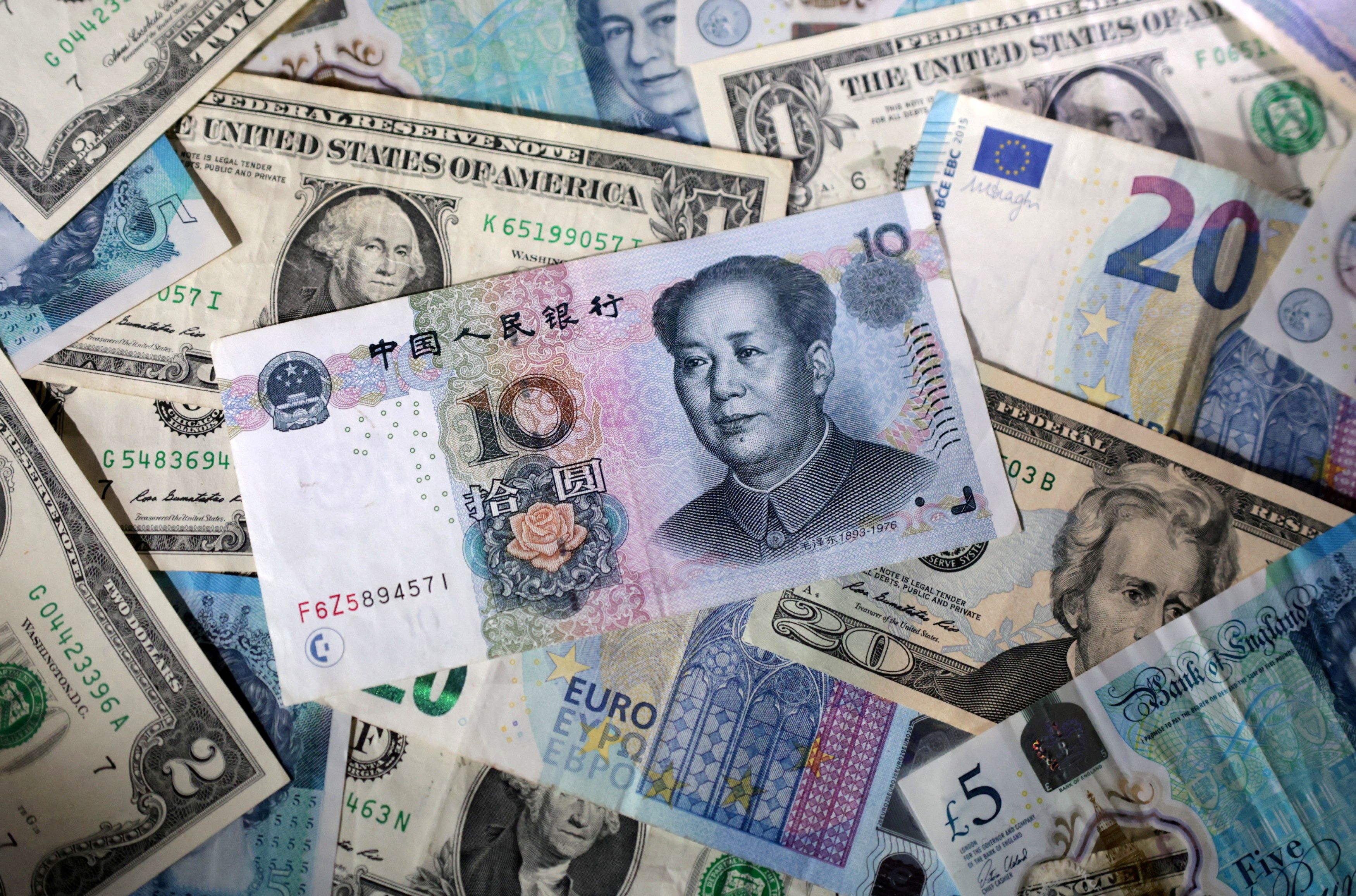 U.S. dollar, euro, Chinese yuan and pound banknotes.