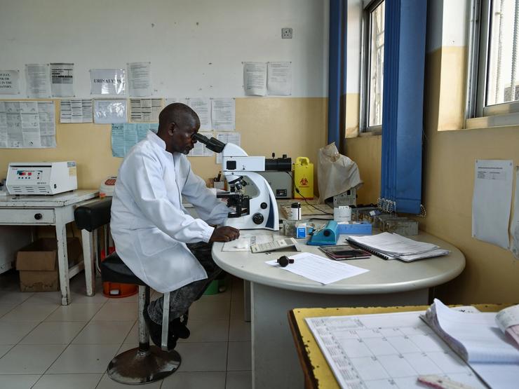 A Zambian doctor conducts tests in the laboratory of Sinozam Friendship Hospital in Kitwe, Zambia.