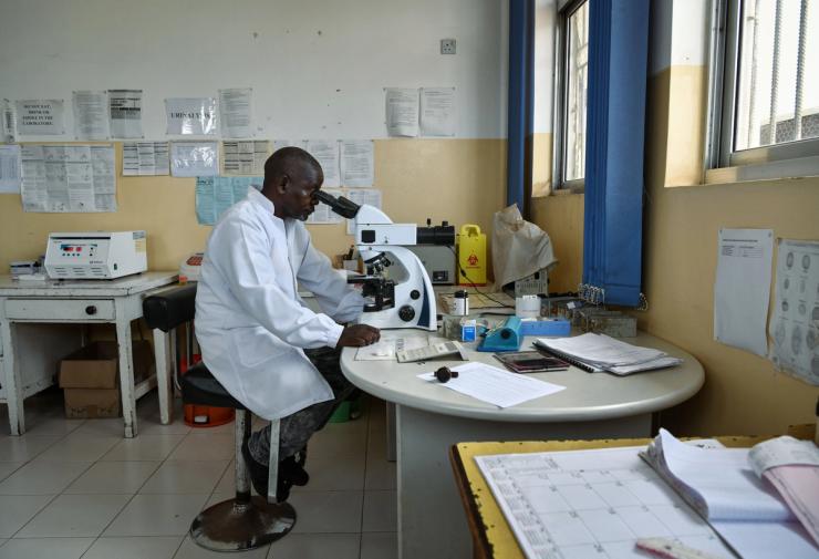 A Zambian doctor conducts tests in the laboratory of Sinozam Friendship Hospital in Kitwe, Zambia.