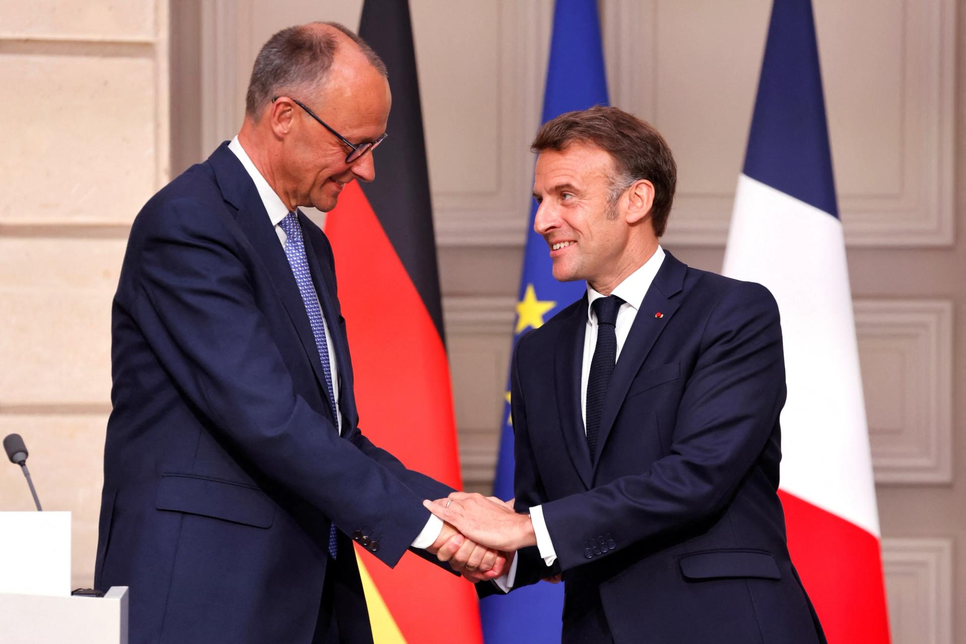 Germany’s newly elected Chancellor Friedrich Merz shakes hands with France’s President Emmanuel Macron on the day of their meeting at the Elysee presidential palace in Paris, France, on May 7, 2025. 
