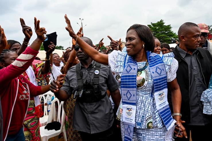 Simone Gbagbo, former First Lady of Côte d’Ivoire and president of the Mouvement des Generations Capable, greets her supporters at a rally in Abidjan on July 5, 2025.