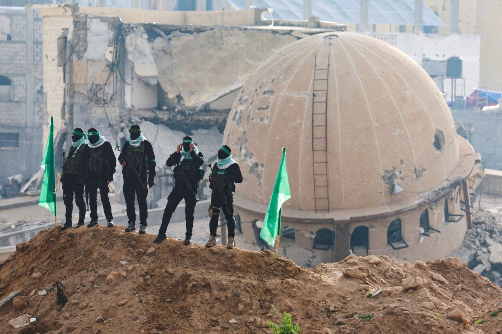 Hamas militants standing guard in Khan Younis, Gaza.