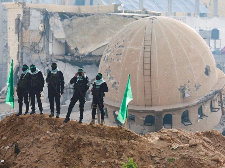 Hamas militants standing guard in Khan Younis, Gaza.