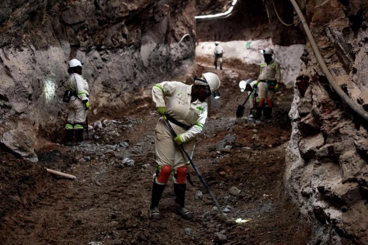 Mine workers work underground at Qala Swallows.