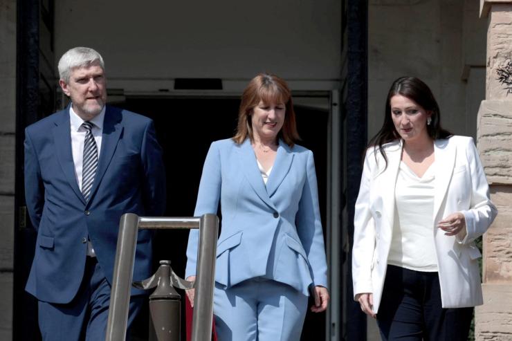 Britain’s Chancellor of the Exchequer Rachel Reeves is accompanied by Finance Minister John O’Dowd and Northern Ireland Deputy First Minister Emma Little-Pengelly