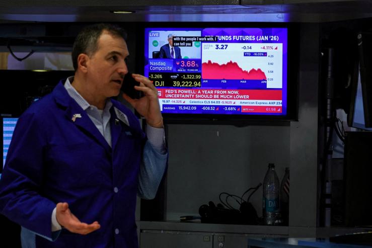 A trader works on the floor at the New York Stock Exchange
