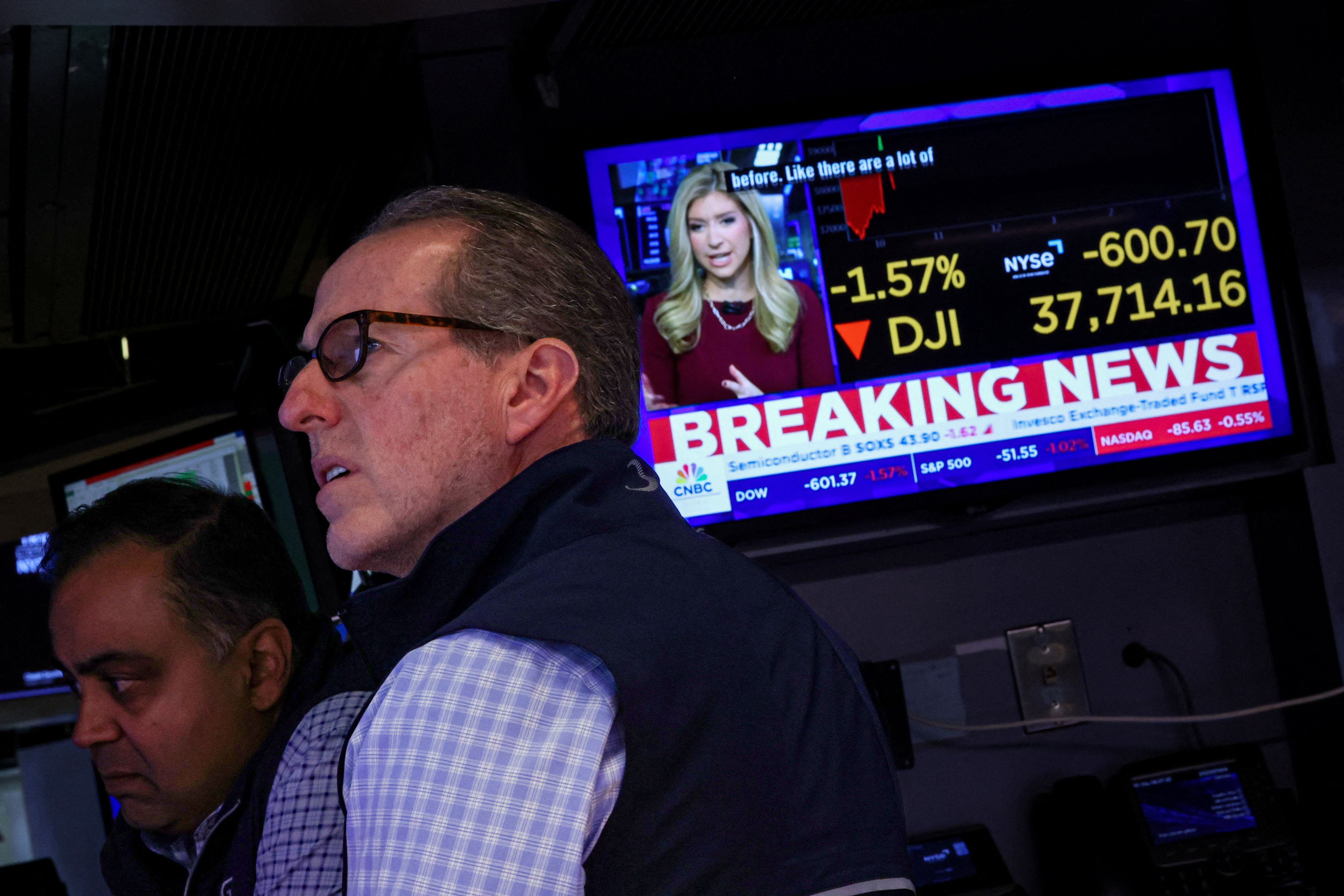 Traders work on the floor at the New York Stock Exchange.