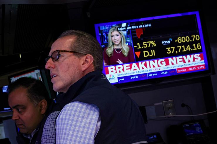 Traders work on the floor at the New York Stock Exchange.
