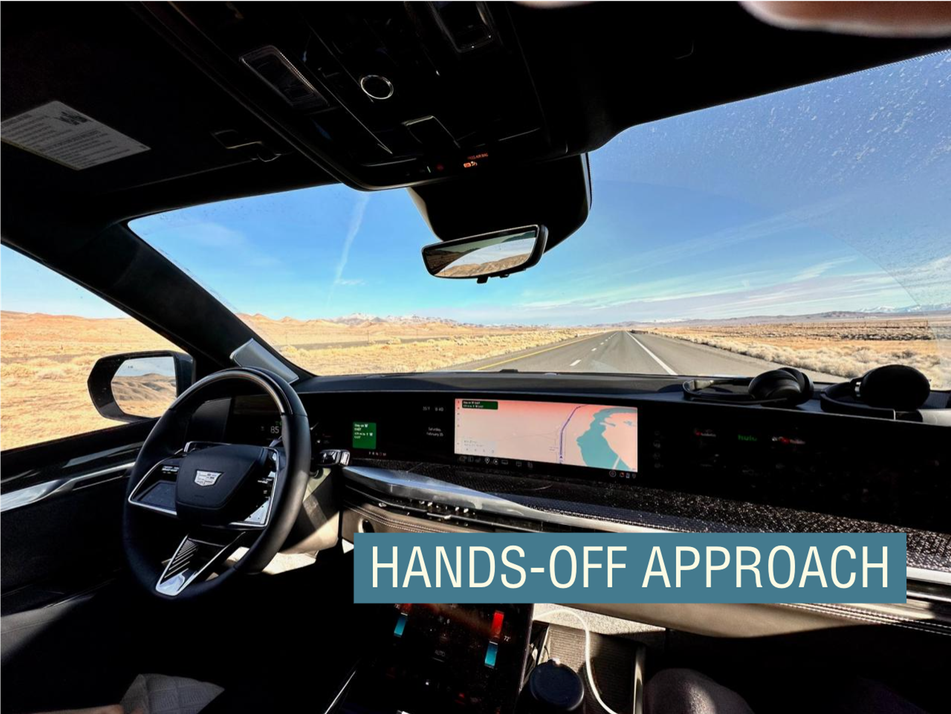 The inside of a self-driving car is seen as it moves on a freeway.