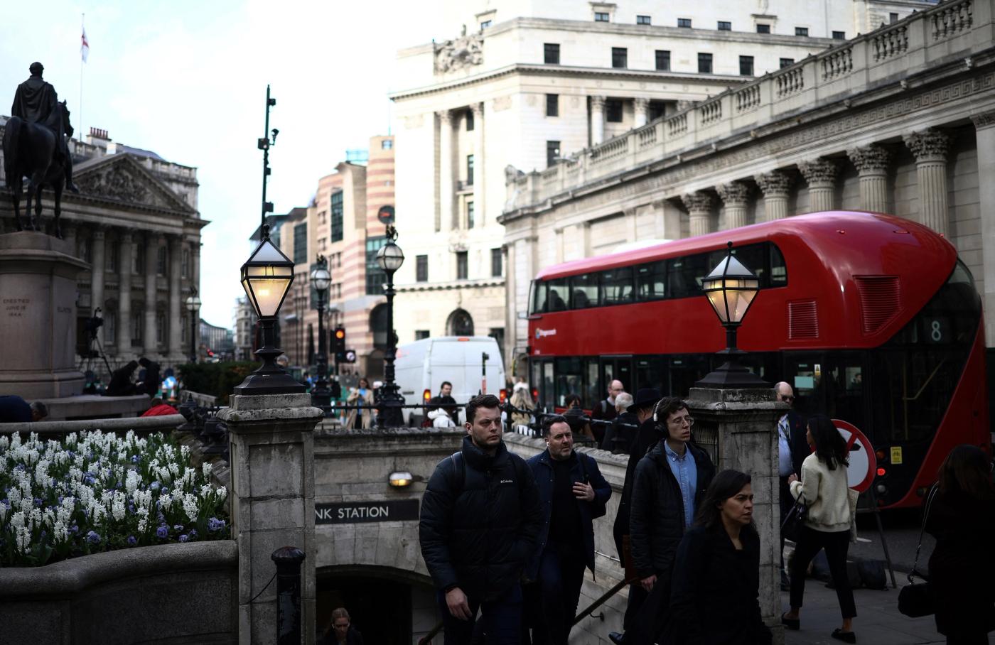People exit an underground station outside the Bank of England in the City of London financial district in London, Britain, March 23, 2023. REUTERS/Henry Nicholls
