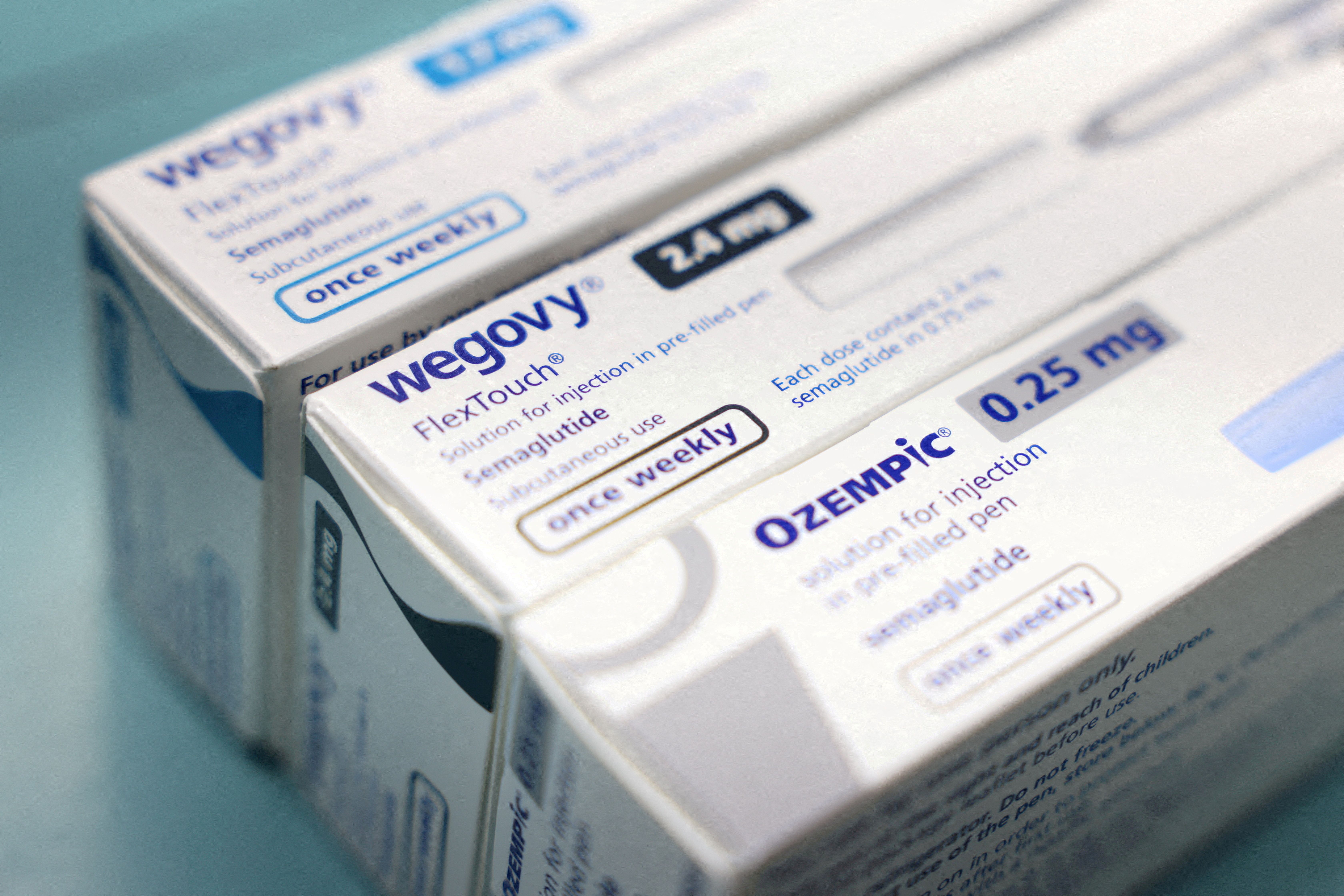 Boxes of Ozempic and Wegovy made by Novo Nordisk are seen at a pharmacy in London.