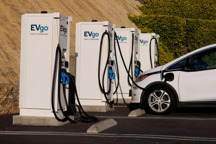 Fast electric vehicle chargers are shown charging a Chevy Bolt in Encintas, California