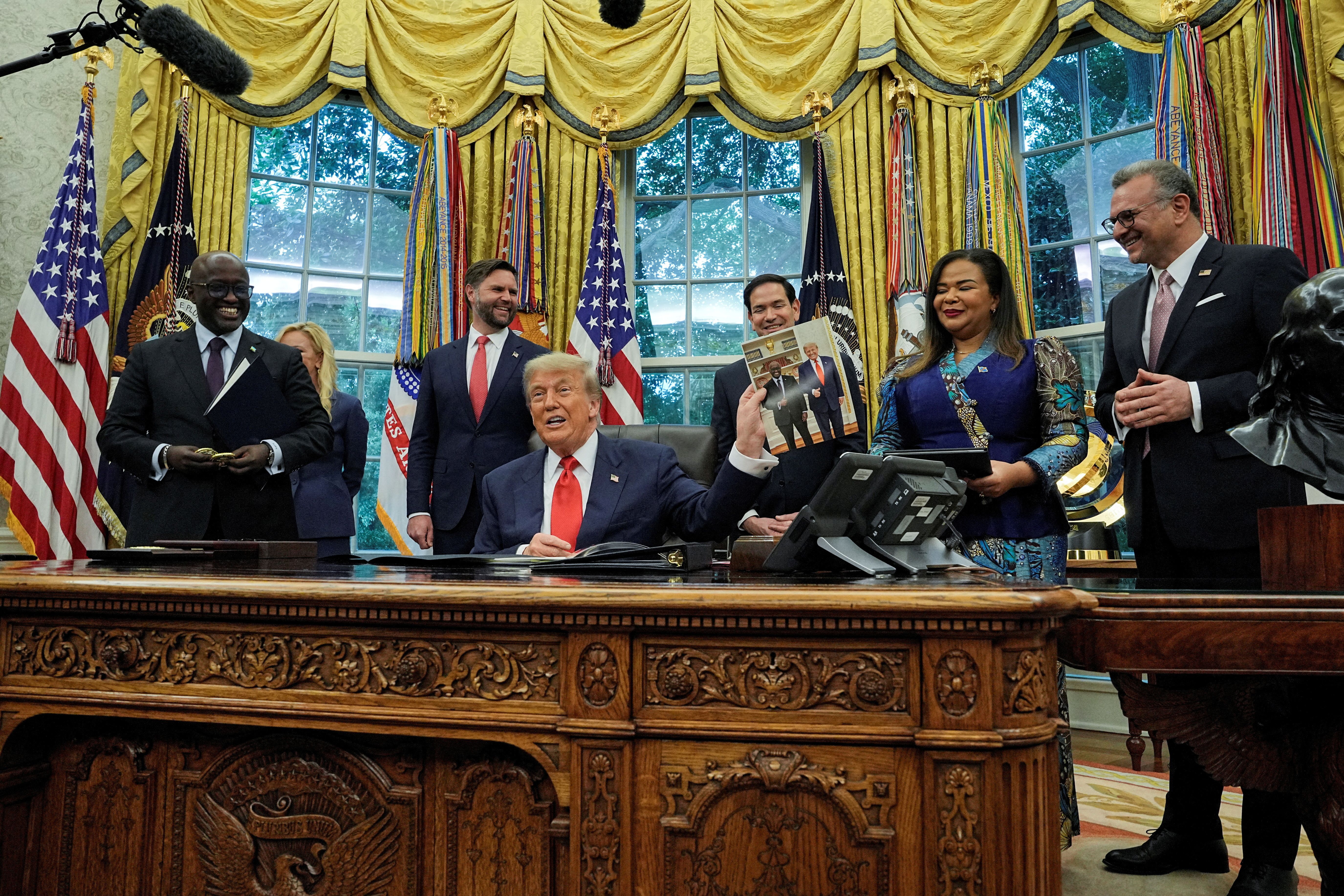 US President Donald Trump at the White House with Rwanda’s Foreign Minister Olivier Nduhungirehe and DR Congo’s Foreign Minister Therese Kayikwamba on June 27, 2025. 