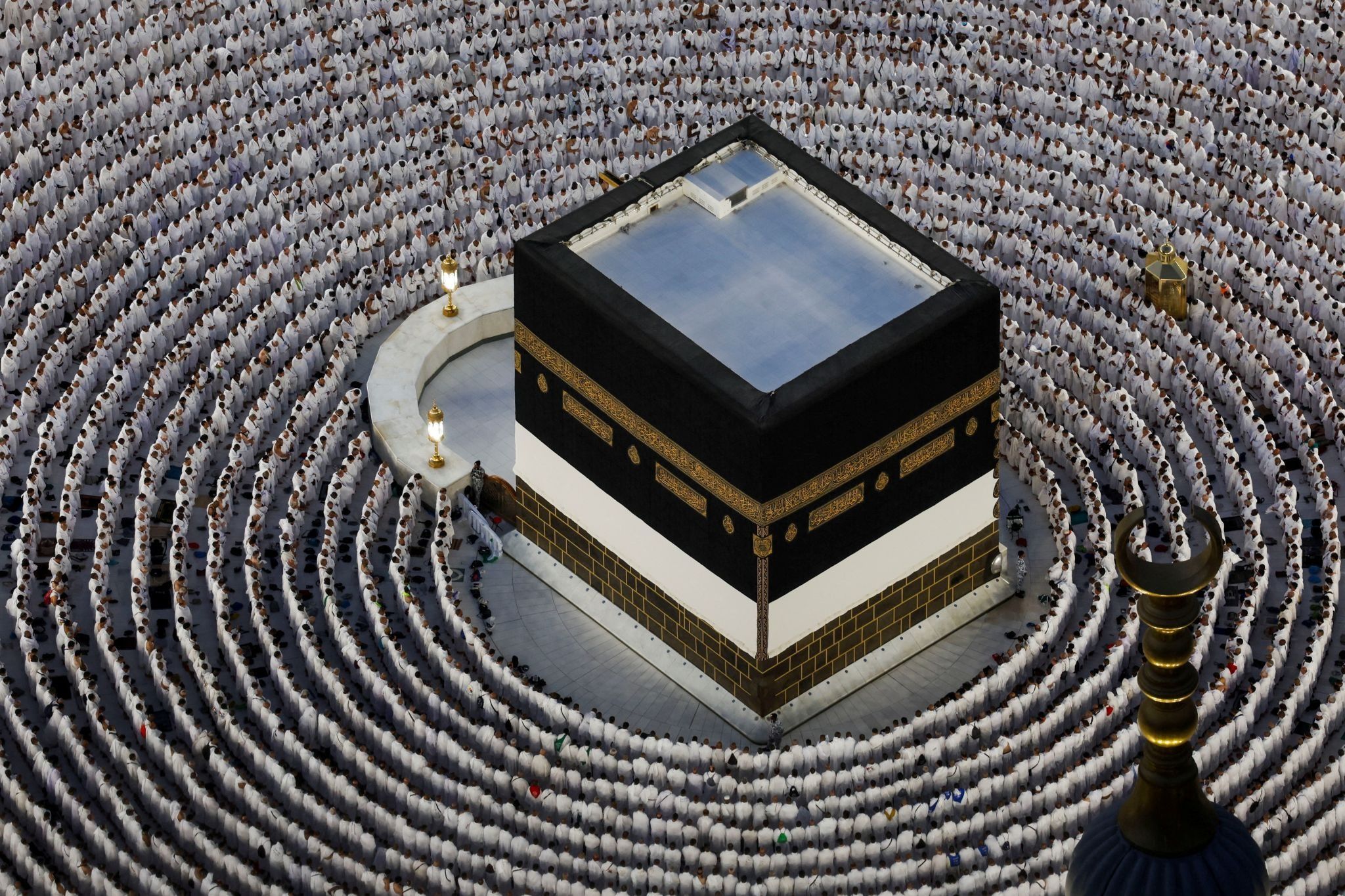 Pilgrims pray in front of Kaaba.