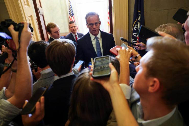 John Thune speaks to reporters