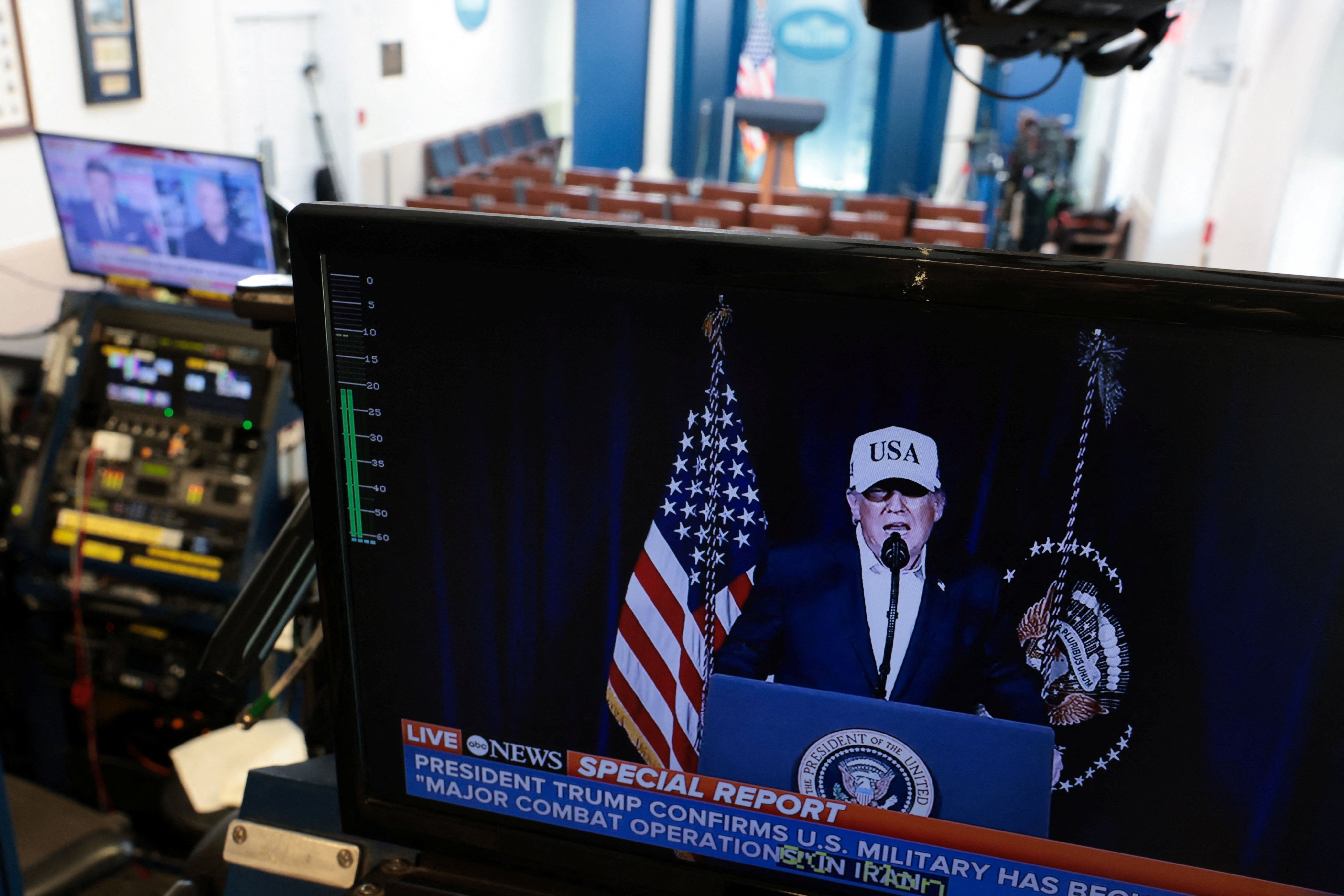 A television monitor shows U.S. President Donald Trump’s earlier announcement in the otherwise empty press briefing room at the White House, while U.S. President Trump is away at his Mar-a-lago Club in Palm Beach, Florida, on the day the United States and Israel led attacks on Iran