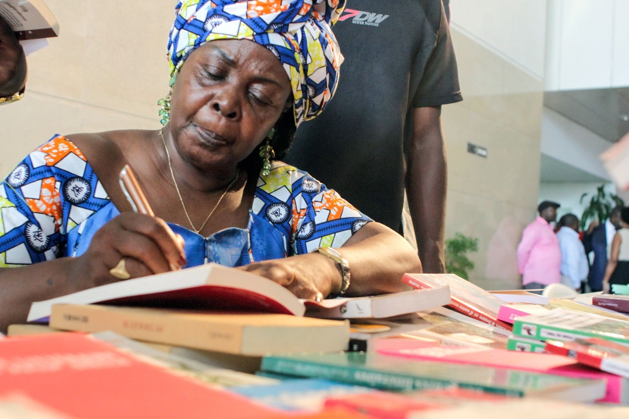 Honorine Ngou, a Gabonese writer, signs books at a festival in Libreville in 2016.