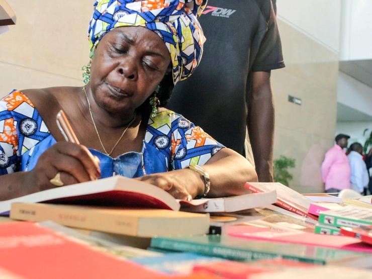 Honorine Ngou, a Gabonese writer, signs books at a festival in Libreville in 2016.