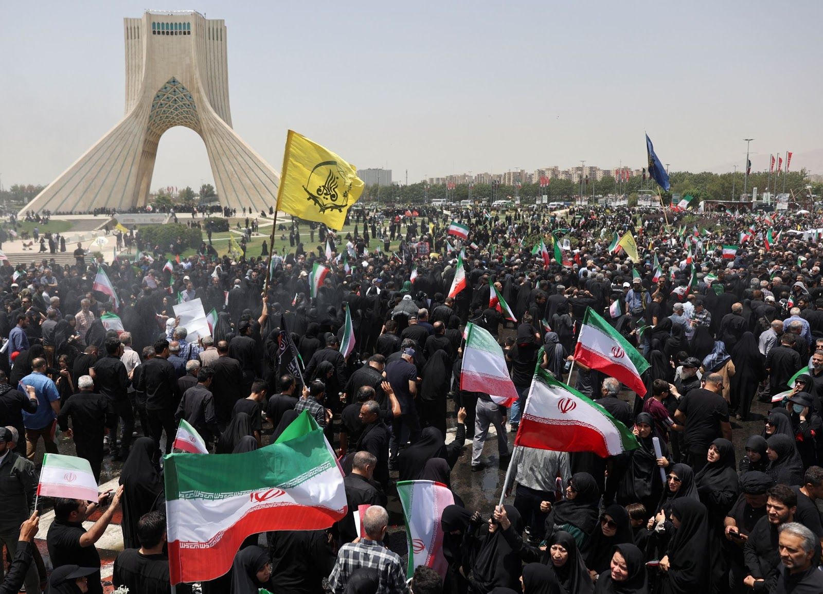 People at a funeral procession in Iran