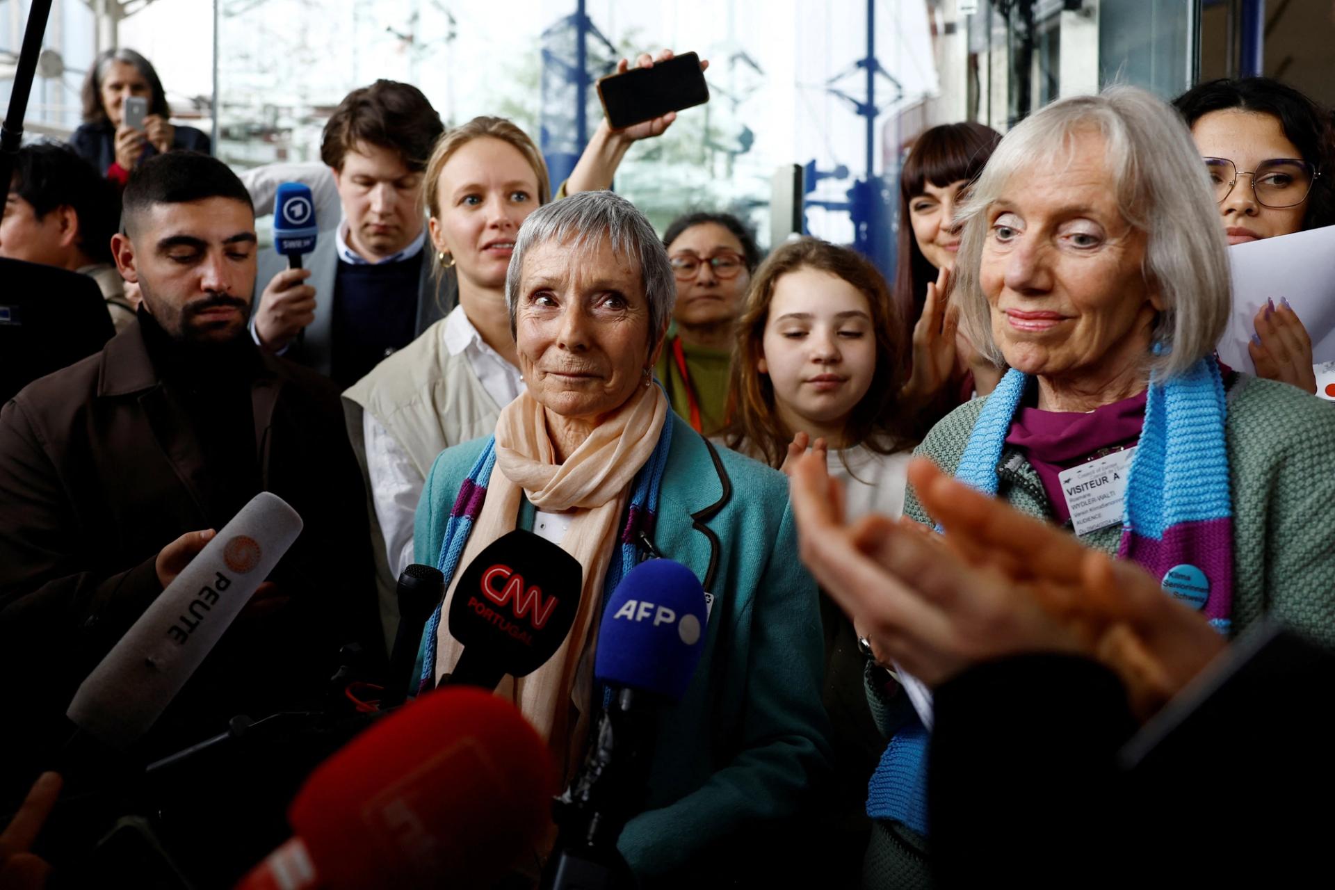 Elderly Swiss women talk to journalists after the verdict of the court in the climate case Verein KlimaSeniorinnen Schweiz and Others v. Switzerland, at the European Court of Human Rights