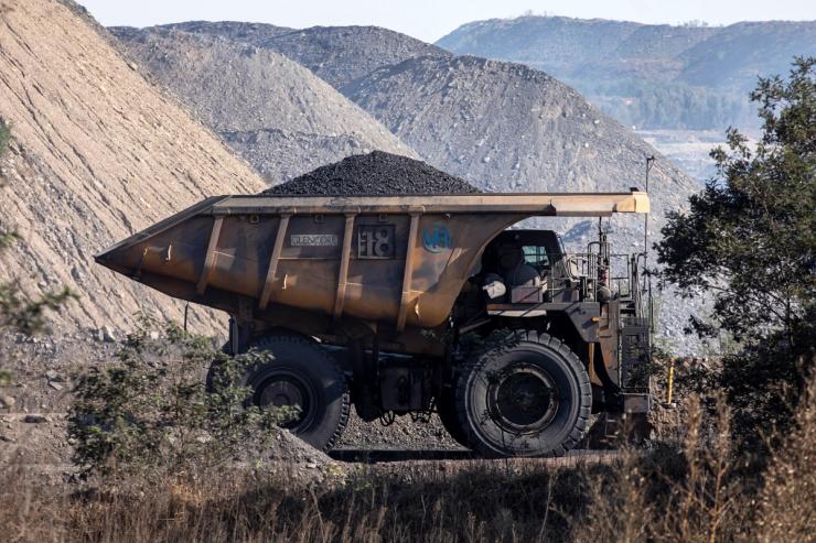A mining truck carries a full load of coal at Glencore Plc operated Tweefontein coal mine.