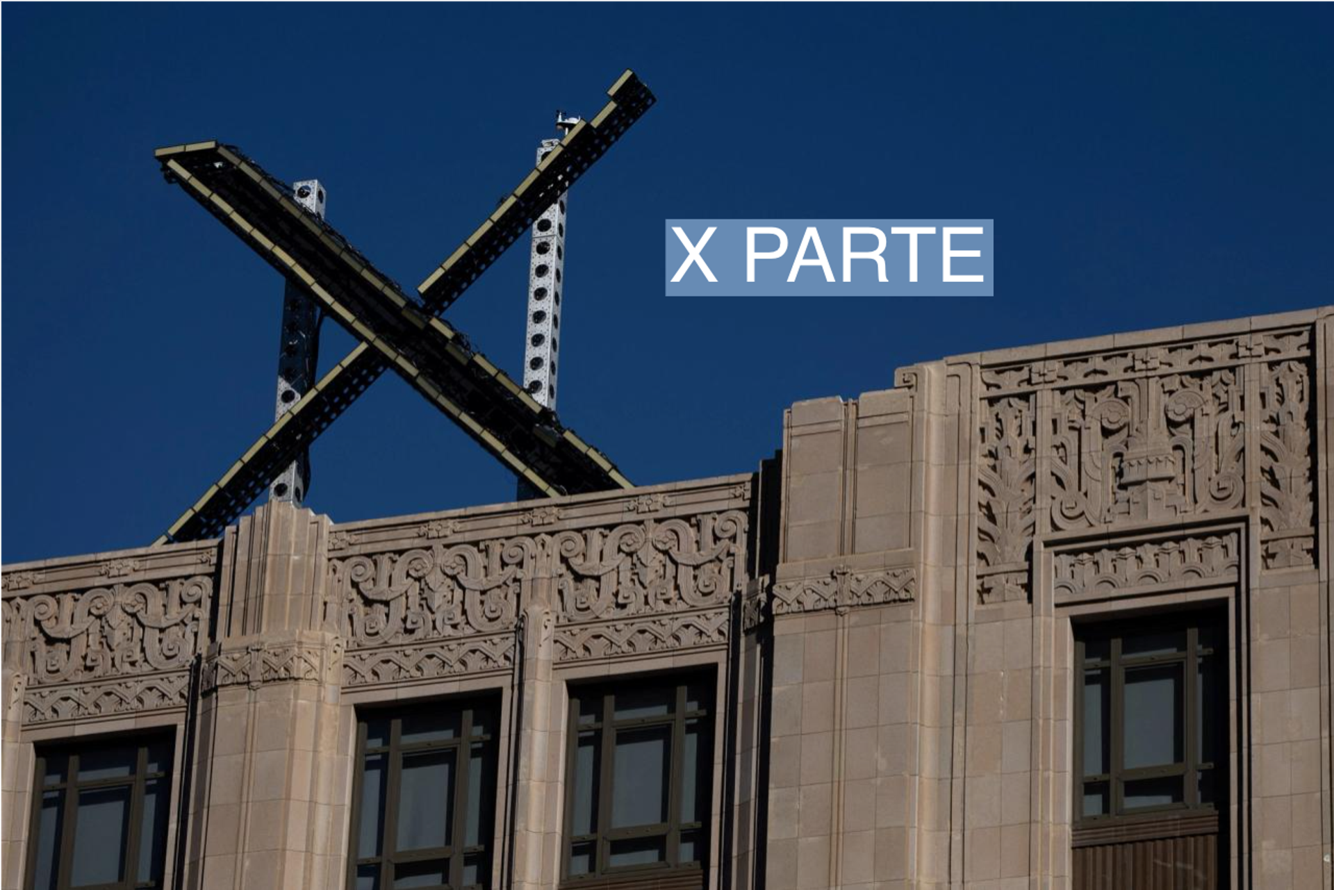 'X' logo is seen on the top of the headquarters of the platform X, formerly known as Twitter.