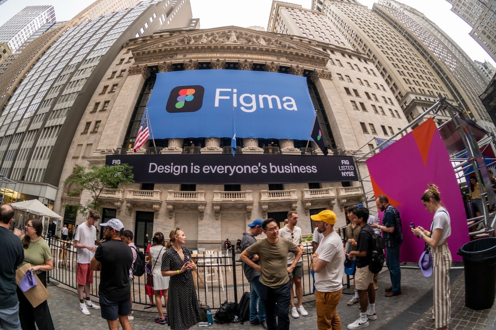People mill outside the New York Stock Exchange on the day of Figma’s IPO.