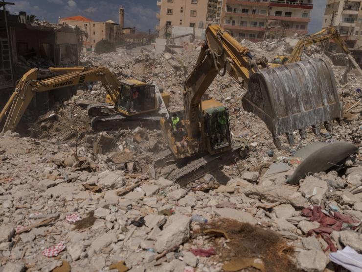 Excavators working on a site in Lebanon after an Israeli strike.