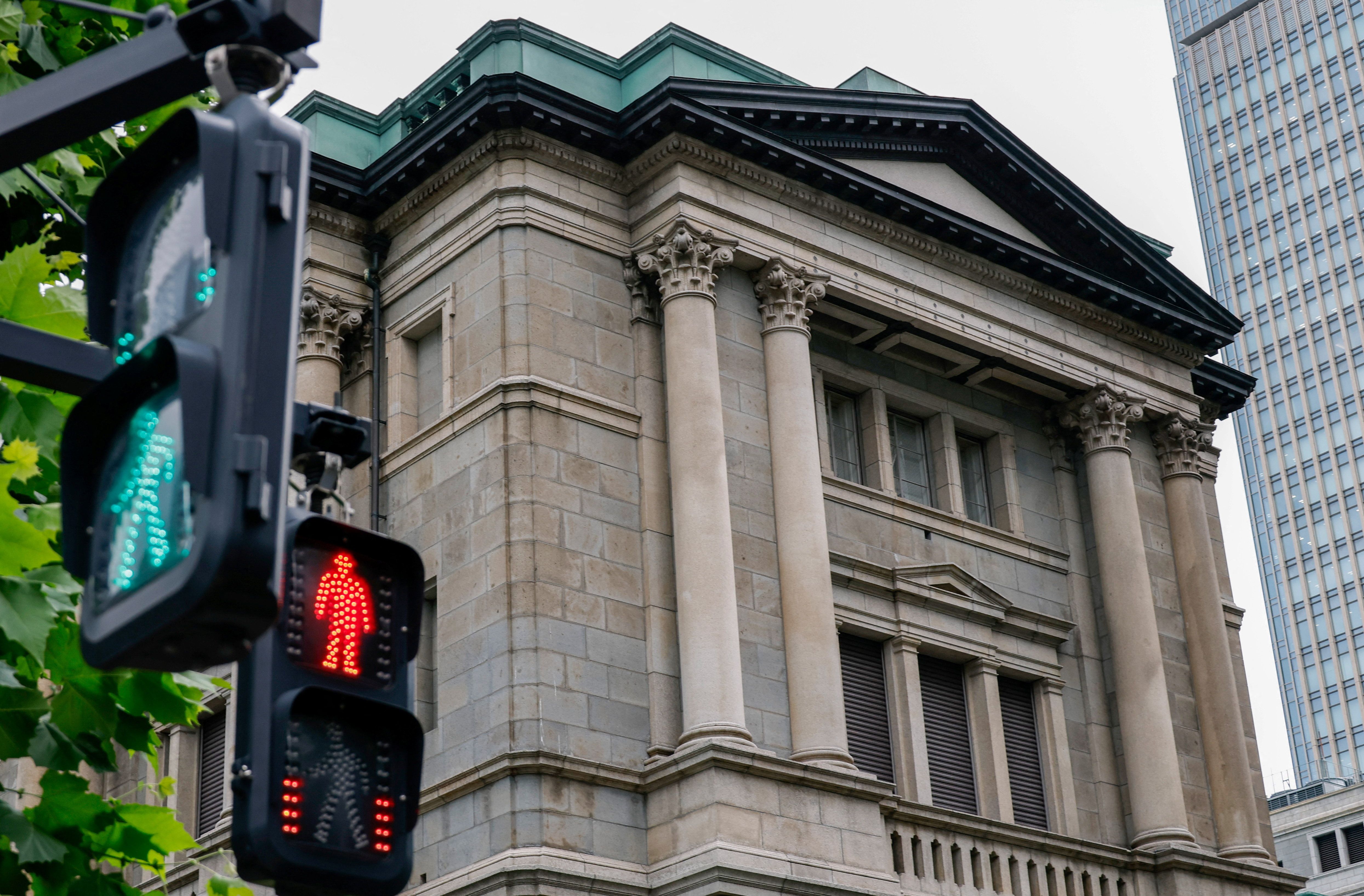 Traffic signs in front of the Bank of Japan building, in Tokyo.