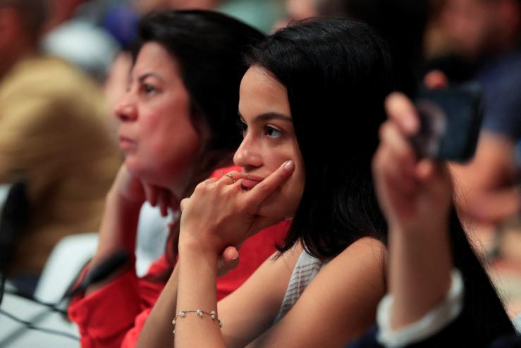 A delegate looks on at the United Nations Climate Change Conference (COP28) in Dubai, United Arab Emirates, December 11, 2023.