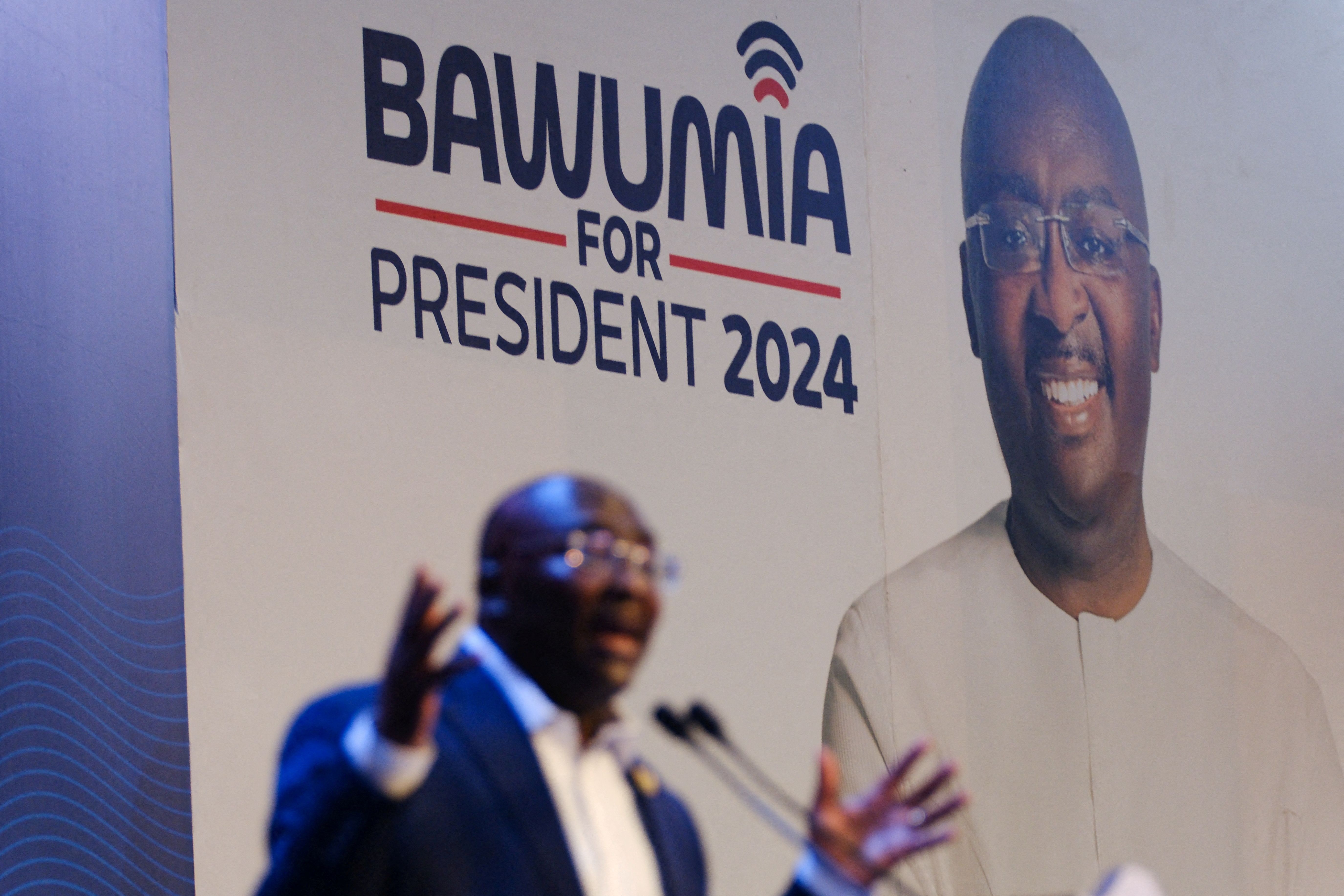 Vice President Mahamudu Bawumia, presidential candidate of Ghana’s ruling New Patriotic Party, delivers a speech next to a poster with his picture during his campaign launch event ahead of the 2024 presidential election in Accra, Ghana, on Feb. 7, 2024.