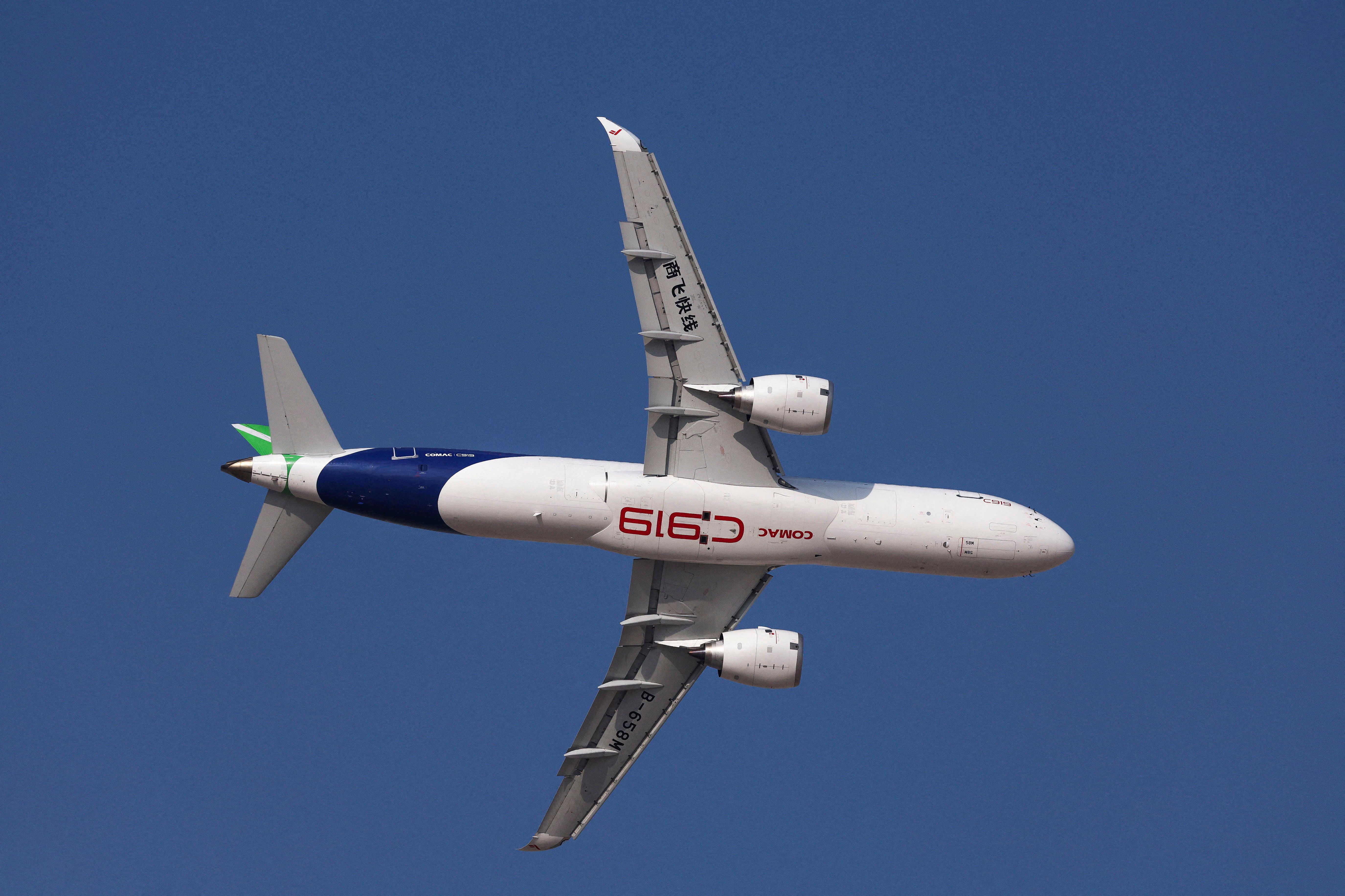 A Comac C919 aircraft performs a flypast at the Dubai Airshow in Dubai.