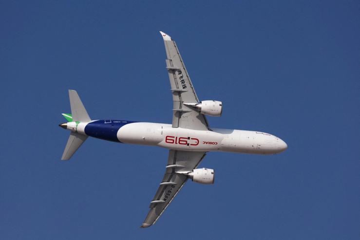 A Comac C919 aircraft performs a flypast at the Dubai Airshow in Dubai.