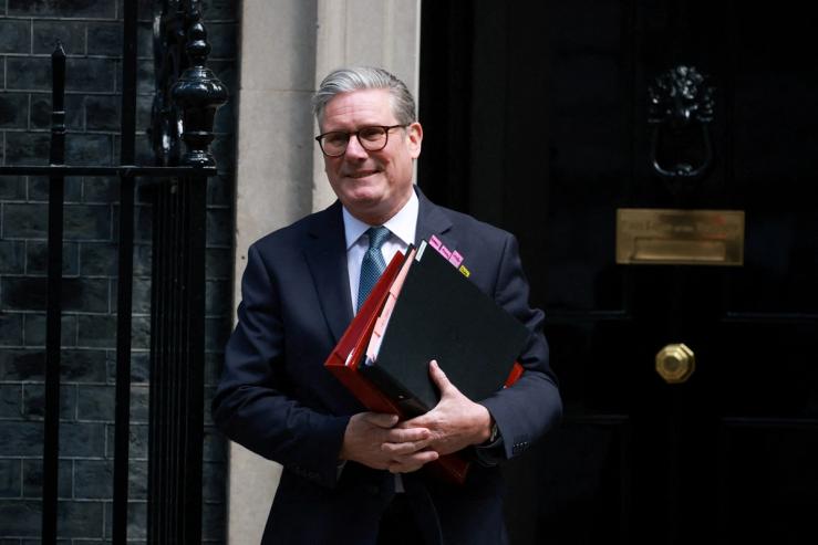 British Prime Minister Keir Starmer leaves 10 Downing Street in London.