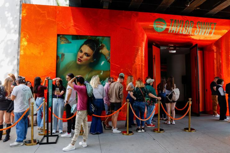 People wait to enter a Spotify pop-up event for Taylor Swift’s album “The Life of a Showgirl” in New York.