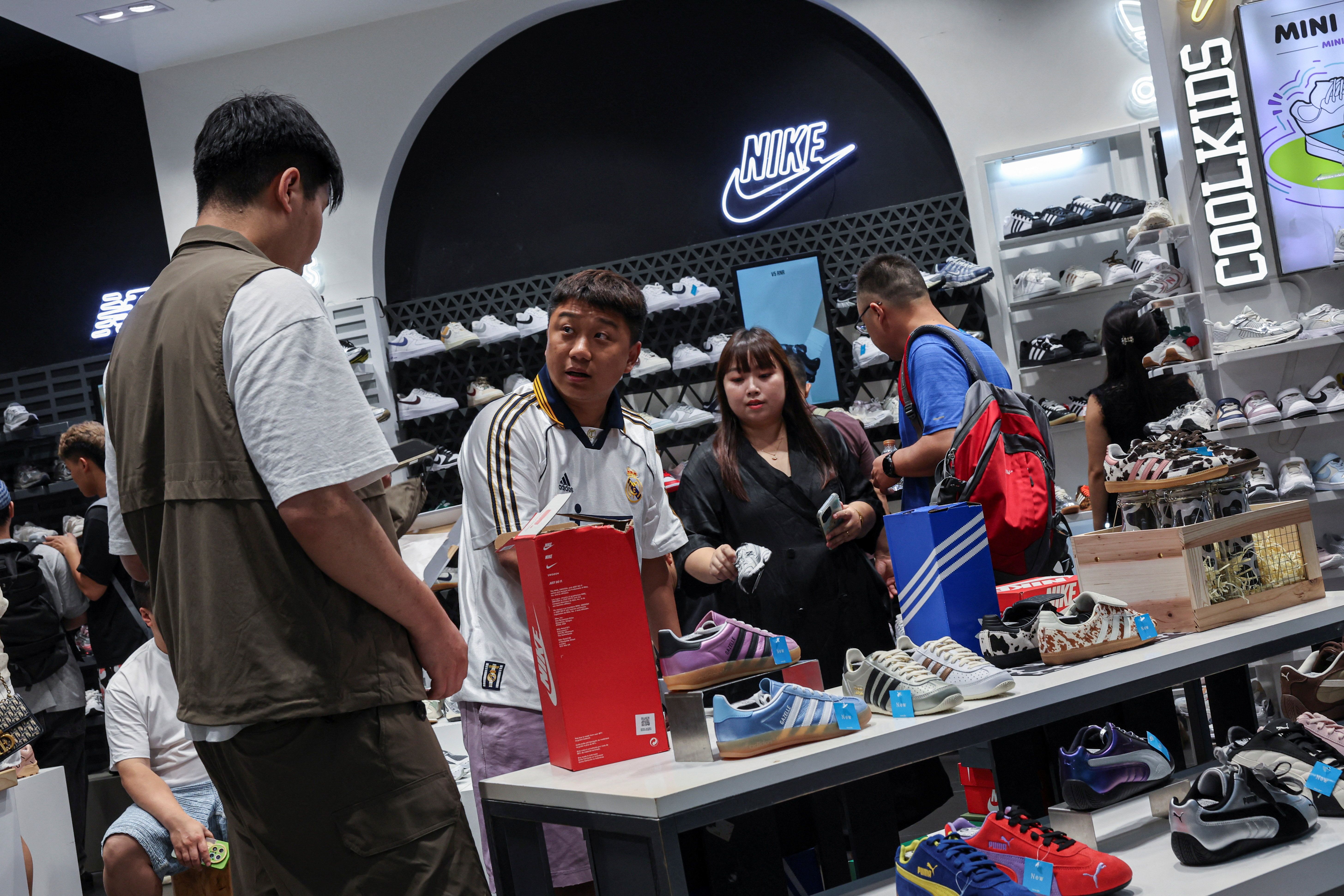 Chinese shoppers in a Macau Nike outlet