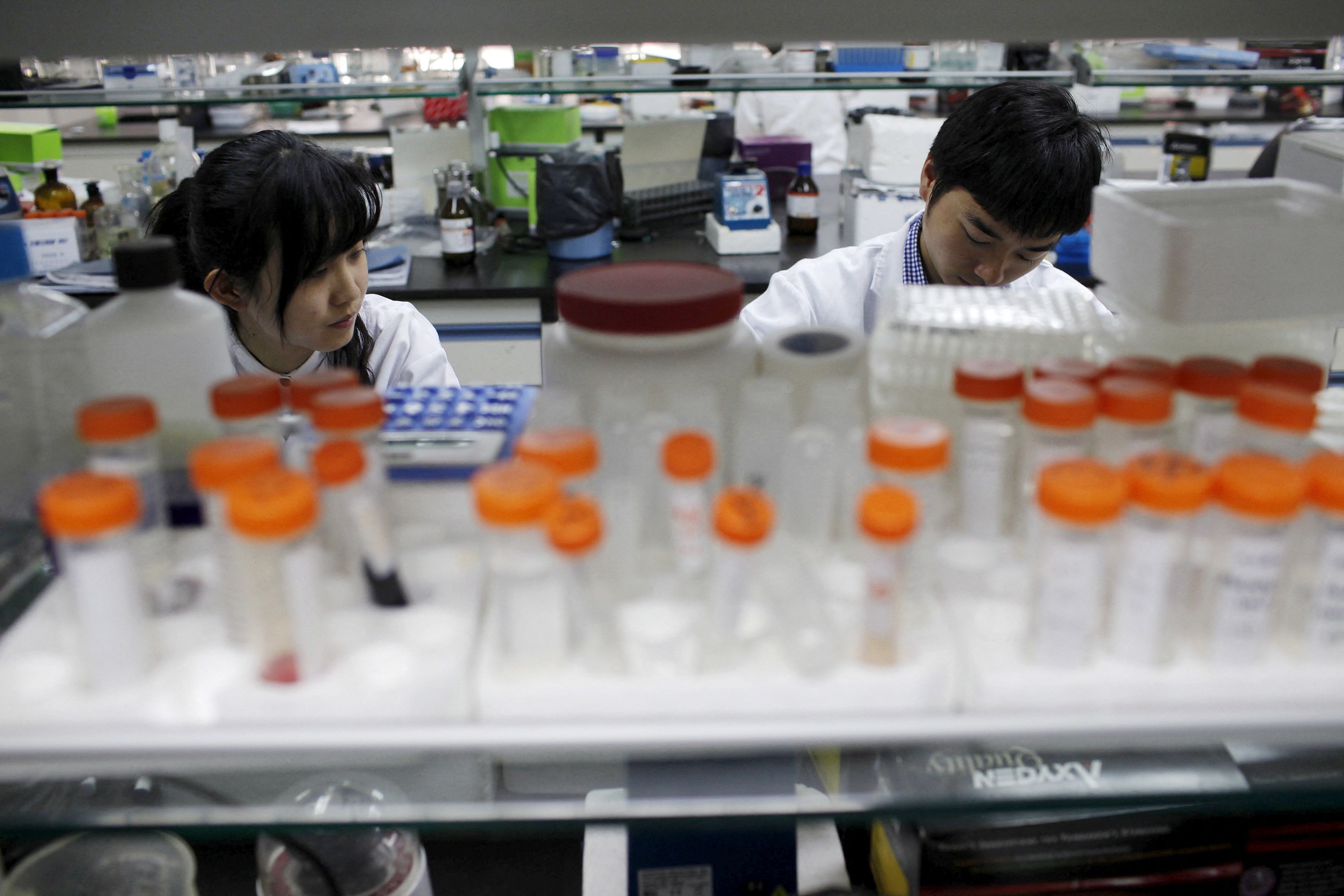 Researchers prepare medicine at a laboratory in Nanjing University.