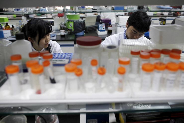 Researchers prepare medicine at a laboratory in Nanjing University.