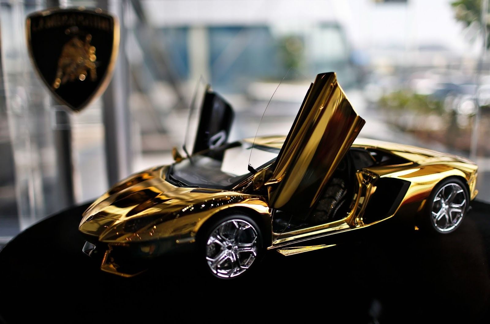 A gold Lamborghini model is on display at the Lamborghini showroom in Dubai.