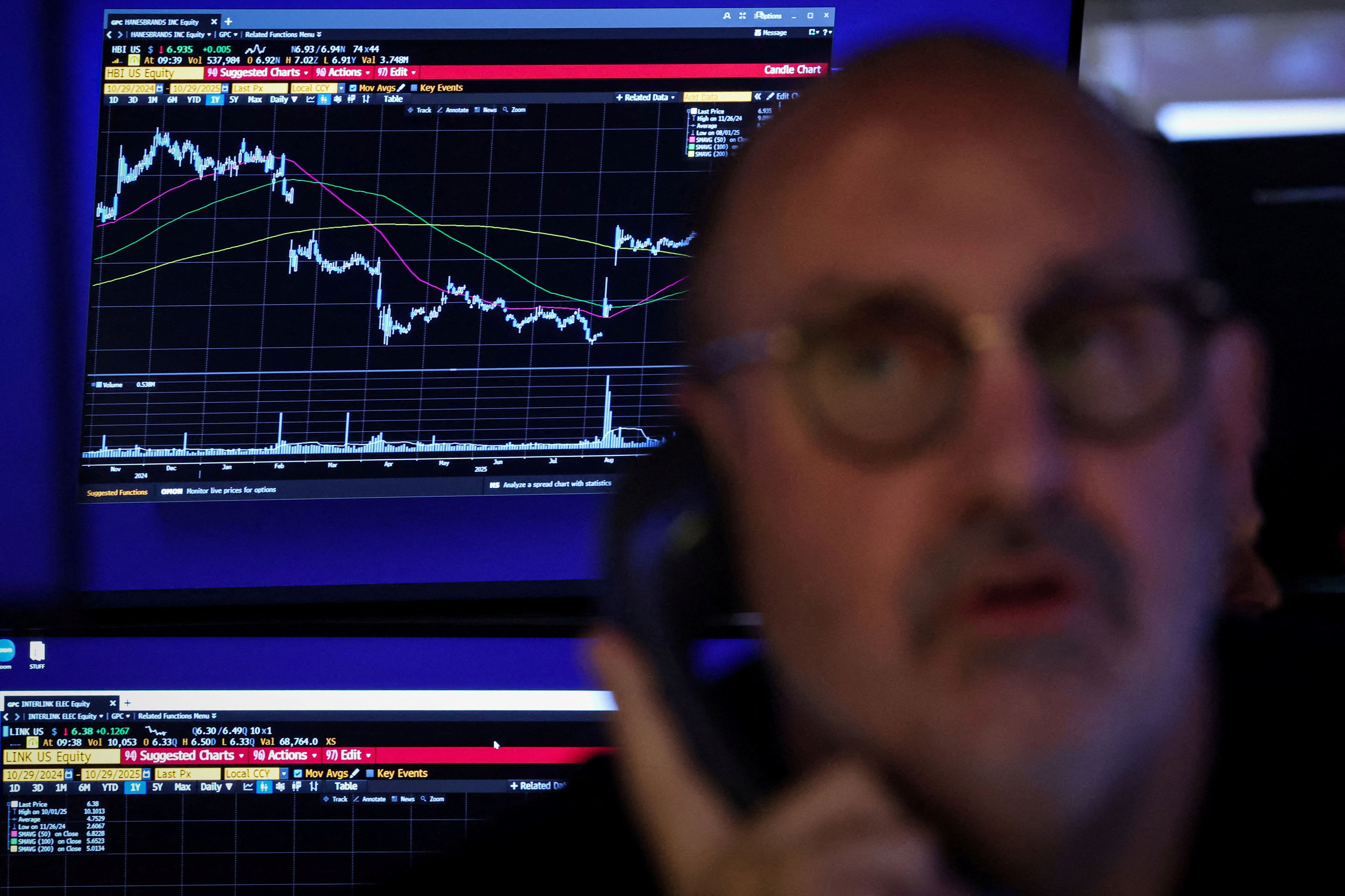 A trader works on the floor at the New York Stock Exchange in New York City.