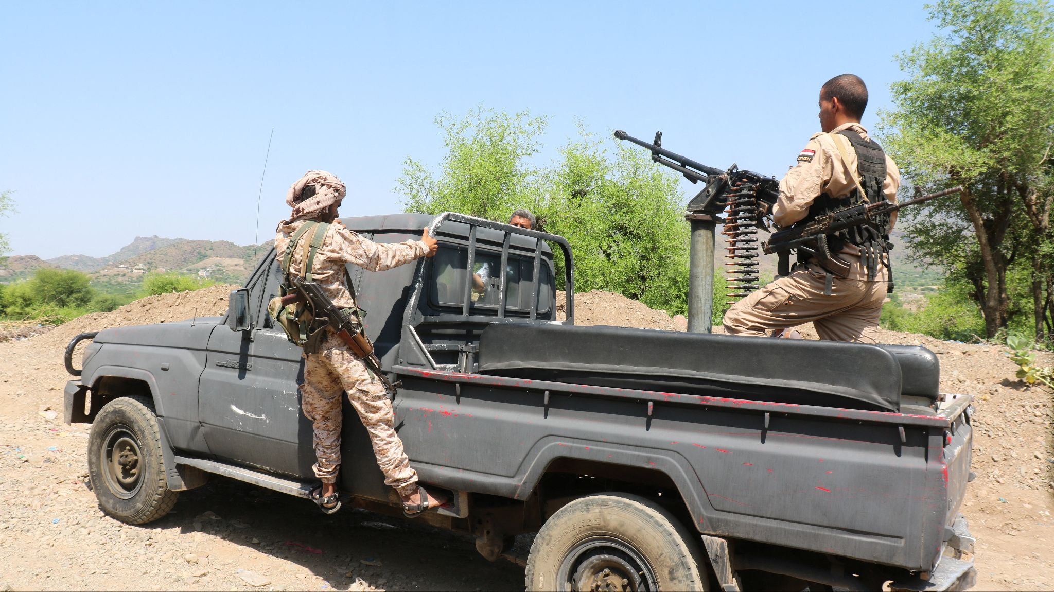 Saudi-backed Yemeni government forces ride on a military pick-up vehicle as they patrol a road leading to a frontline of clashes with Iran-aligned Houthi fighters, in Taiz province, Yemen, Sept. 30, 2026. 